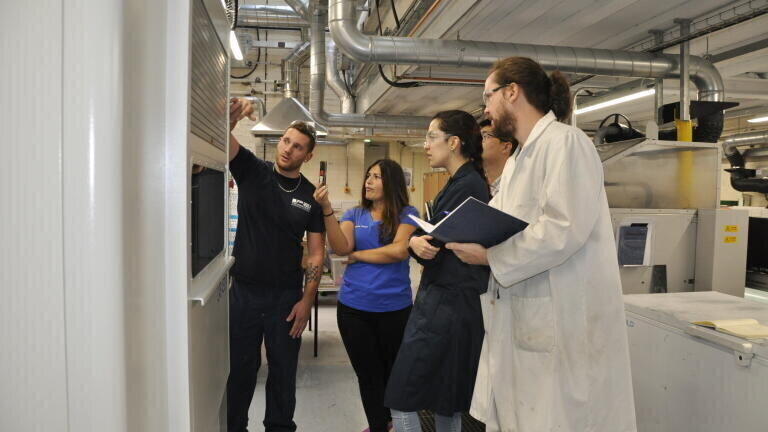 Training in place: P.E.I’s Dard Judicael instructs PhD students Eva Pappa, Helena Pérez Martin and Dr Colin Robert in the art of recipe building on the platen press. 